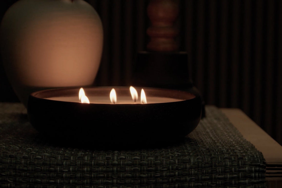 A candle burning in a dark room.